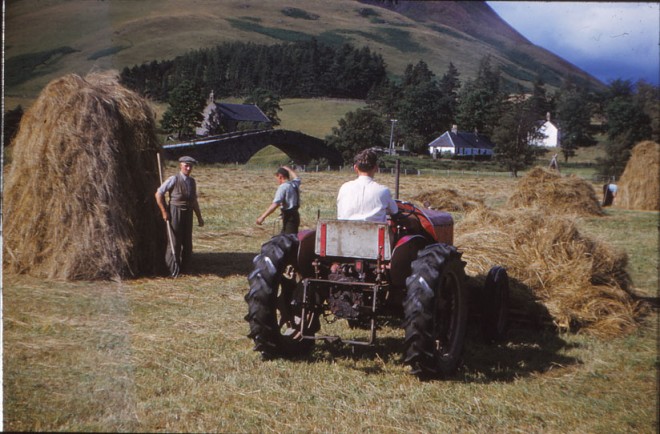 Jim Ramsay (holding fork) and Dennis Winton (on tractor).