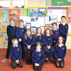 The pupils who took part, in front of the display they created.