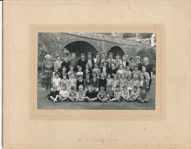 Carol: 'That was taken on the putting green about 1953/1954. The teacher on the left is Mrs Menzies and she taught the younger children. The head teacher was Mrs MacGregor and she taught the older ones. I am in the 3rd row back and 3rd from the right. My brother David is in the front row 3rd from the right'.