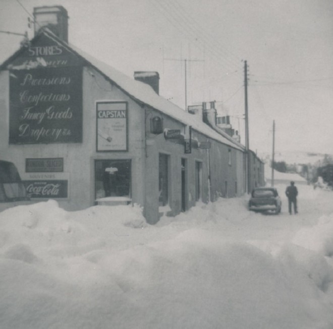 Main Street Kirkmichael in the snow. Jock MIlne by the car. 16/02/1963